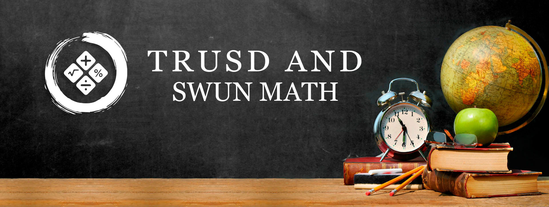 TRUSD and SWUN Math - A globe, an alarm clock, and apple and other items are sitting on a table.